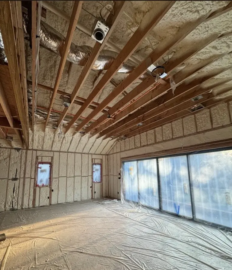 Interior walls and ceiling insulated with spray foam during new construction in Doolittle